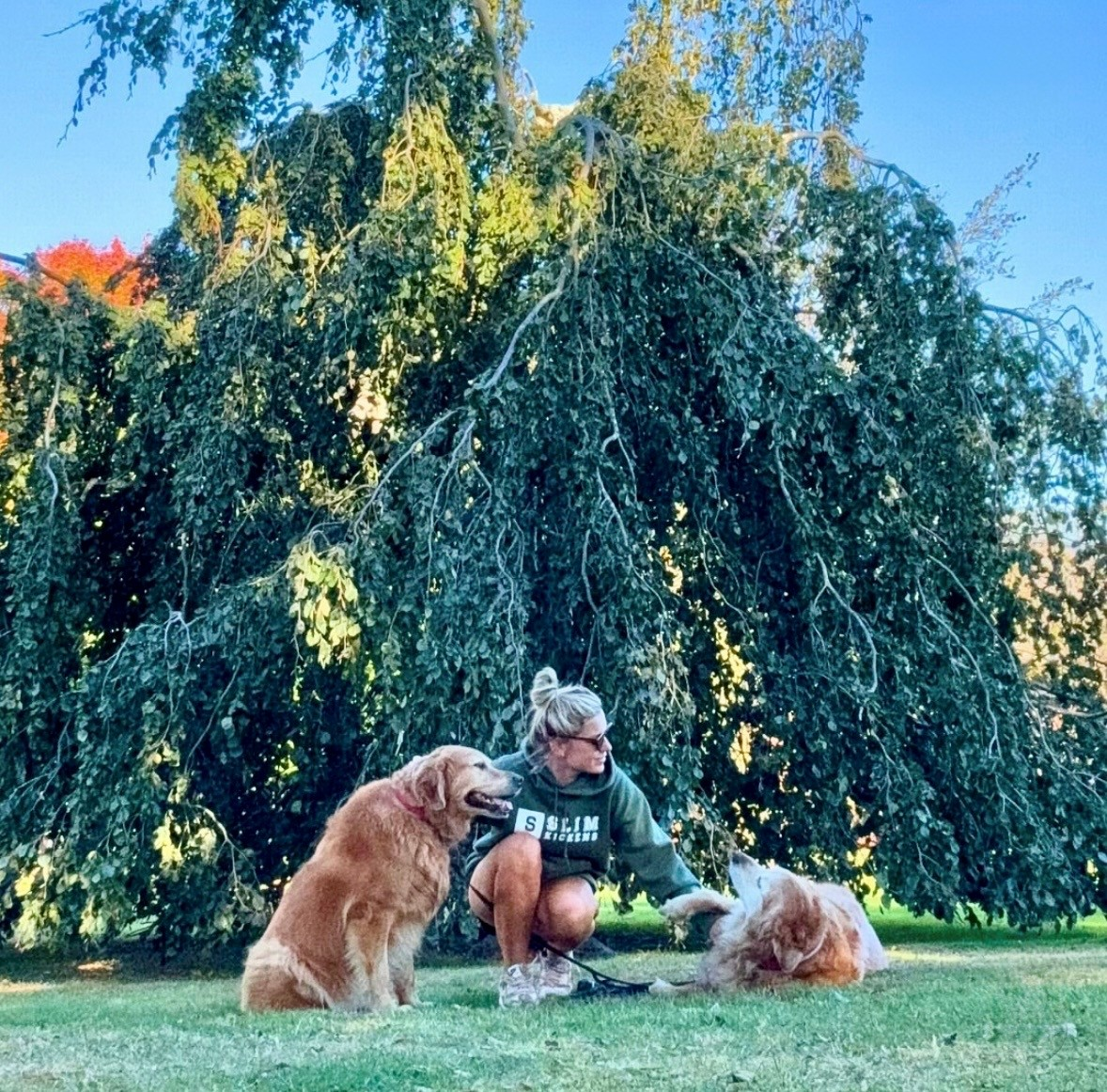 Kim with her dogs outdoors